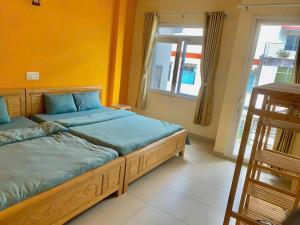Letto o letti in una camera di Gold's House