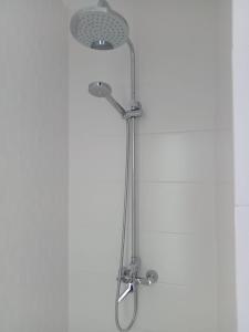 a shower with a shower head in a bathroom at Nunoli Duplex Luxury Playa Blanca in Playa Blanca