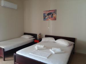 A bed or beds in a room at Studios Achileus 2