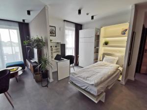 Posteľ alebo postele v izbe v ubytovaní Smart Apartament Grunwaldzka 240