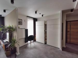 Televízia a/alebo spoločenská miestnosť v ubytovaní Smart Apartament Grunwaldzka 240