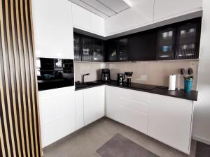 Kuchyňa alebo kuchynka v ubytovaní Smart Apartament Grunwaldzka 240