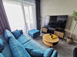 Televízia a/alebo spoločenská miestnosť v ubytovaní Smart Apartament Grunwaldzka 240