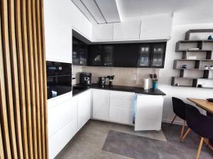 Kuchyňa alebo kuchynka v ubytovaní Smart Apartament Grunwaldzka 240