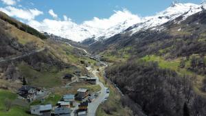 an aerial view of a village in the mountains at La faucille in Praranger