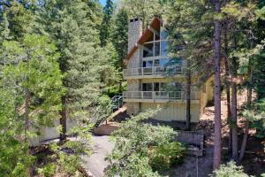 an aerial view of a house in the woods at Luxe Mountain Retreat Lake Village Close Game Room AC Backs up to trails in Lake Arrowhead