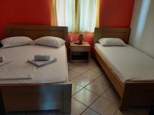 A bed or beds in a room at Studios Achileus 2