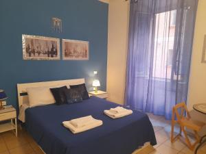 Postel nebo postele na pokoji v ubytování Casa Roma Affittacamere + 23 fotografií