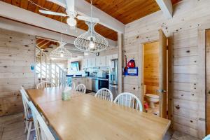a kitchen and dining room with a table and chairs at Caravelle 1 in Ocean City