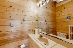 a bathroom with a sink and a mirror at Caravelle 1 in Ocean City +20 photos