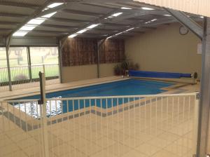 a large swimming pool with a ceiling at Breakaway Farmstay in Encounter Bay