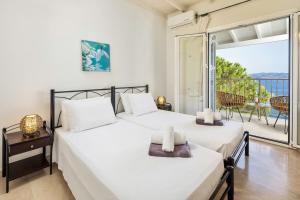 Ένα ή περισσότερα κρεβάτια σε δωμάτιο στο Villa Anastar +39 φωτογραφίες