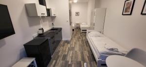 a hospital room with a bed and a sink at Pensjonat Senya in Niechorze +59 photos