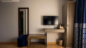 TV a/nebo společenská místnost v ubytování Farina Hotel By Cigno