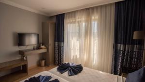 Postel nebo postele na pokoji v ubytování Farina Hotel By Cigno