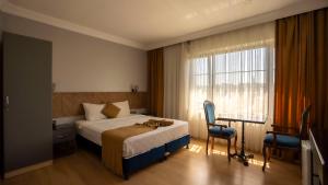 Postel nebo postele na pokoji v ubytování Farina Hotel By Cigno