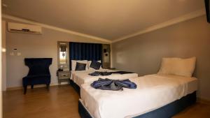 Postel nebo postele na pokoji v ubytování Farina Hotel By Cigno