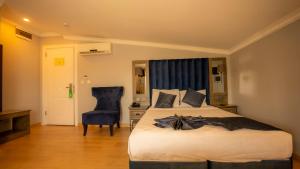 Postel nebo postele na pokoji v ubytování Farina Hotel By Cigno