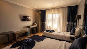 TV a/nebo společenská místnost v ubytování Farina Hotel By Cigno