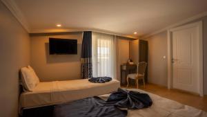 Postel nebo postele na pokoji v ubytování Farina Hotel By Cigno