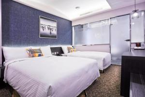 Voodi või voodid majutusasutuse V-one Hotel - Ningxia No. 2 Inn toas