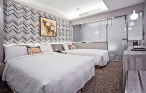 Voodi või voodid majutusasutuse V-one Hotel - Ningxia No. 2 Inn toas