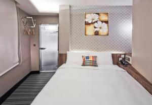 Voodi või voodid majutusasutuse V-one Hotel - Ningxia No. 2 Inn toas