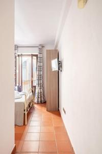 A bed or beds in a room at TEMPIO DI APOLLO - ORTIGIA con Veranda Privata