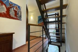 A bed or beds in a room at TEMPIO DI APOLLO - ORTIGIA con Veranda Privata