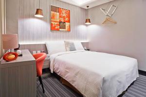 Voodi või voodid majutusasutuse V-one Hotel - Ningxia No. 2 Inn toas
