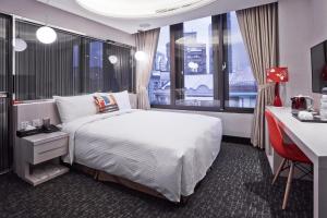 Voodi või voodid majutusasutuse V-one Hotel - Ningxia No. 2 Inn toas