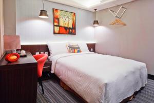 Voodi või voodid majutusasutuse V-one Hotel - Ningxia No. 2 Inn toas