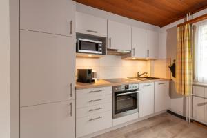 Кухня або міні-кухня у CPM Apartments