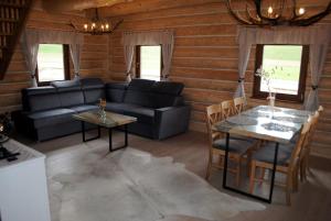 a living room with a couch and a table at Chaty NOVA pri Pieninách in Spišská Stará Ves
