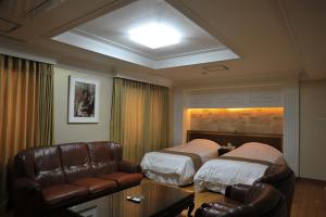 Vuode tai vuoteita majoituspaikassa Palace Hotel Gwangju