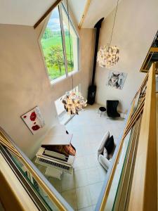an overhead view of a living room with a window at Villaveyron in Roussennac