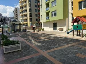 an empty playground in a city with tall buildings at Roses in Sofia