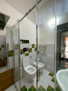 a bathroom with a toilet and a sink and a shower at Villa ValePina in Villasimius +60 photos