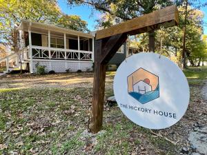 a sign for the therapy house in front of a house at The Hickory House with Firepit- Boat Ramp Access to Cedar Creek Lake in Tool