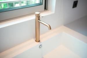 a sink in a kitchen with a window at Granny's House in Kos Town