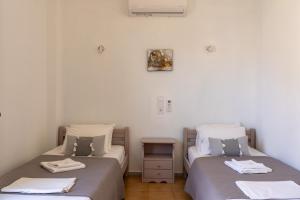 Posteľ alebo postele v izbe v ubytovaní Giannis Rooms