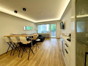 a kitchen and dining room with a table and chairs at Ferienwohnung Brilon - Willingen in 10min in Brilon