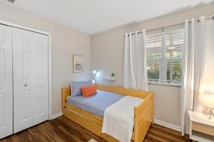 a bedroom with a bed and a window at The Hickory House with Firepit- Boat Ramp Access to Cedar Creek Lake in Tool