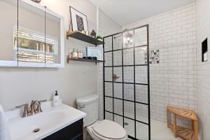 a bathroom with a toilet and a sink at The Hickory House with Firepit- Boat Ramp Access to Cedar Creek Lake in Tool +34 photos
