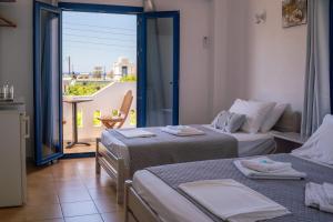 Posteľ alebo postele v izbe v ubytovaní Giannis Rooms