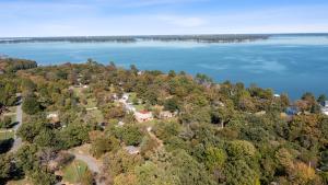 an aerial view of a house on the shore of a lake at The Hickory House with Firepit- Boat Ramp Access to Cedar Creek Lake in Tool