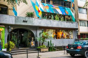 a car parked in front of a building at Miraflores Apartments in Lima