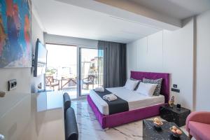 a bedroom with a bed and a living room at Vip penthouse patra in Patra +88 photos