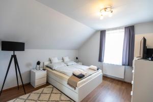 Postel nebo postele na pokoji v ubytování Park Apartman