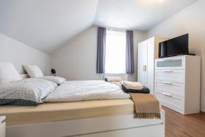 Postel nebo postele na pokoji v ubytování Park Apartman